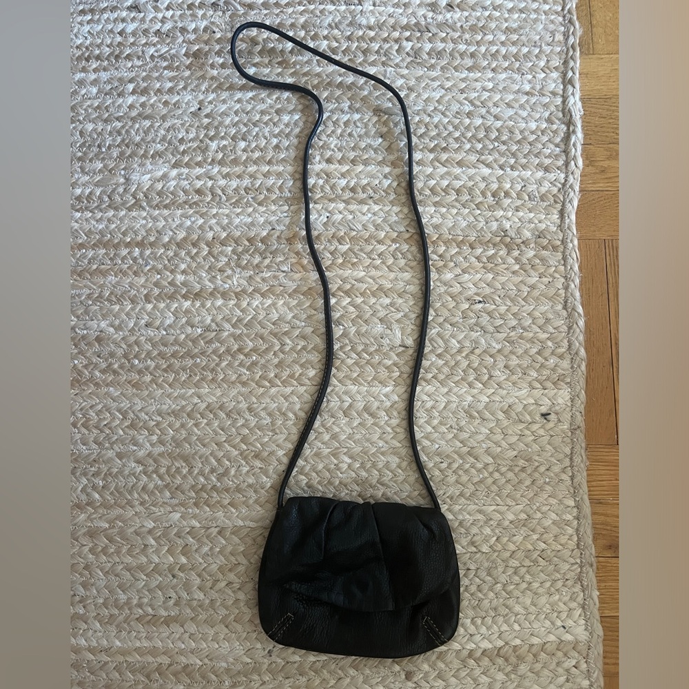 black fossil crossbody bag. on condition. slightly worn